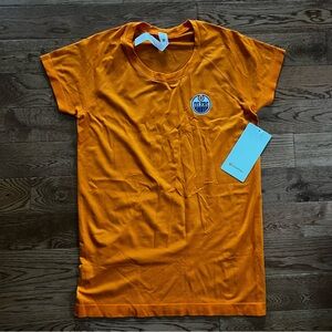 Lululemon x Oilers NWT size 10 swiftly tech 2.0 orange with oilers logo